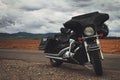 Black motorcycle parked on country road Royalty Free Stock Photo