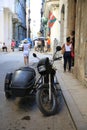 Black motorcycle with a sidecar on the street of Old Havana Royalty Free Stock Photo