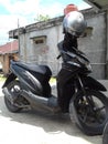 Black Motorcyle and Helmet Matic