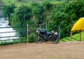 Black Motorcyle Parked Outdoor, Near Waterfall