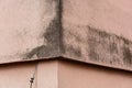 Black mould growing on wall of heat insulated flats building. It is common issue with polystyrene boards home insulation installed