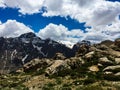 Black mountain range in the distance covered with snow. Royalty Free Stock Photo