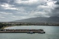 2 black mountains tower over pier in Kahului, Maui, Hawaii, USA