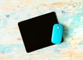 Black mousepad with blue mouse Royalty Free Stock Photo