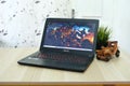 Black msi gaming laptop, on a wooden table in the office room Royalty Free Stock Photo