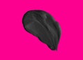 Black mud face mask, dark cosmetic product sample isolated on pink background