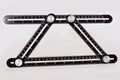 Black multi function Ruler isolated on white background. Royalty Free Stock Photo