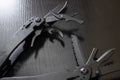 Black multi tool on wooden table closeup Royalty Free Stock Photo
