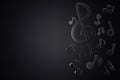 Black music notes of song melody flowing in the air on a dark background.