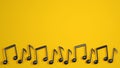 Black music notes on yellow background. Modern design for music event or festival. 3D rendered image. Royalty Free Stock Photo