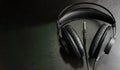 Black music production headphones on black background