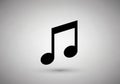 Black musical note symbol on a light gray background. The design features a pair of eighth notes Royalty Free Stock Photo