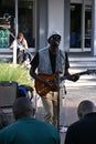 Black musician playing guitar on the street in Victoria and Alfred waterfront area in Cape Town, South Africa Royalty Free Stock Photo