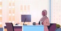 black muslim businesswoman sitting at workplace and using computer arab businesswoman working in office