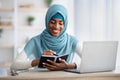 Black Muslim Lady Taking Notes To Notepad While Working At Home Office Royalty Free Stock Photo