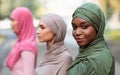 Black Muslim Woman Posing With Diverse Islamic Ladies Standing Outdoor