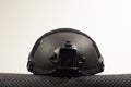 Black nato military helmet on white background