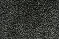 Black natural fleece carpet texture background. Dark wool fabric texture. fragment gray shaggy mat Royalty Free Stock Photo