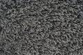 Black natural fleece carpet texture background. Dark wool fabric texture. fragment gray shaggy mat Royalty Free Stock Photo