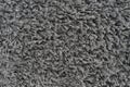 Black natural fleece carpet texture background. Dark wool fabric texture. fragment gray shaggy mat Royalty Free Stock Photo