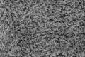 Black natural fleece carpet texture background. Dark wool fabric texture. fragment gray shaggy mat Royalty Free Stock Photo