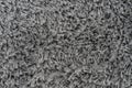 Black natural fleece carpet texture background. Dark wool fabric texture. fragment gray shaggy mat Royalty Free Stock Photo