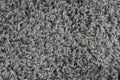 Black natural fleece carpet texture background. Dark wool fabric texture. fragment gray shaggy mat Royalty Free Stock Photo