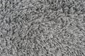 Black natural fleece carpet texture background. Dark wool fabric texture. fragment gray shaggy mat Royalty Free Stock Photo