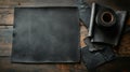 Black natural leather rolls and sheets on dark background Royalty Free Stock Photo