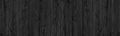 Black natural shabby wood board panoramic background. Rough old grainy wooden plank dark wide texture Royalty Free Stock Photo