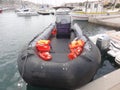 A black nautical boat, tied up in a Breton port - France