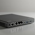A black networking device, possibly a router or switch, featuring a sleek rectangular Royalty Free Stock Photo