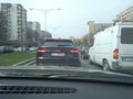 Black new Audi Q8 in traffic. Road view through car windshield, cars on road in traffic in Bucharest, Romania, 2021 Royalty Free Stock Photo