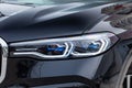 Black new BMW X7 xDrive40i 2019 year front led headlight view with light gray interior on parking in the street Royalty Free Stock Photo