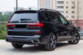 Black new BMW X7 xDrive40i 2019 year rear view with lifht gray interior on parking in the street Royalty Free Stock Photo