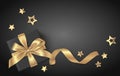 Black New Year holiday background with gift box and gold stars Royalty Free Stock Photo