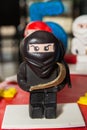 Black ninja lego mini figure on birthday cake