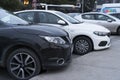A black Nissan Qashqai and a white Fiat Egea are at the parking lot at Istanbul