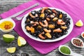 Black noodles with prawns and mussels on white dish Royalty Free Stock Photo