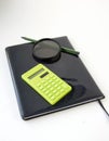 Black notebook, calculator, lens and pencil. A set of designer, engineer, worker, builder