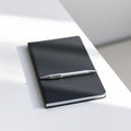 Black Notebook with Silver Pen Royalty Free Stock Photo