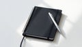 Black Notebook with Silver Pen Royalty Free Stock Photo