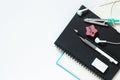 Black notebook with White pencil and eraser, black pencil for drawing on a white table, school concept with copy space, Top view, Royalty Free Stock Photo