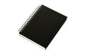 Black notebook for writing or drawing on spiral, isolated on white background Royalty Free Stock Photo