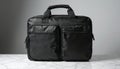Black nylon laptop bag with front zipper pockets and handle. Modern business accessory for tech and travel needs. Durable, Royalty Free Stock Photo