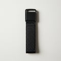 A black nylon strap with a square plastic buckle. The strap appears durable, featuring Royalty Free Stock Photo