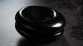 A black object sitting on a table Royalty Free Stock Photo
