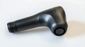 A black object with a small black button on the end