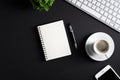 Black office desk table with paper notepad, pen, cup of coffee, computer keyboard, smartphone. Flat lay, top view, copy space. Royalty Free Stock Photo