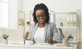 Black Office Girl Sitting At Laptop Taking Notes At Work